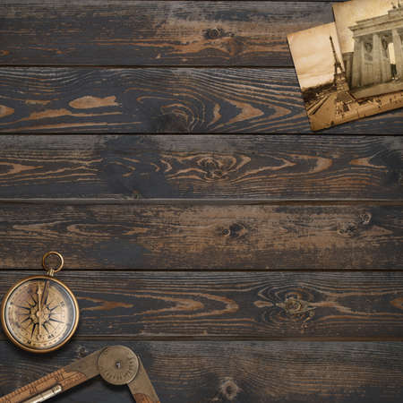 Old wood background with compass. Adventure or discovery concept.