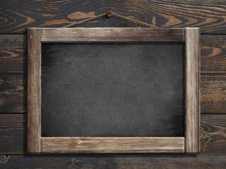 Aged green menu blackboard hanging on wooden wallの写真素材