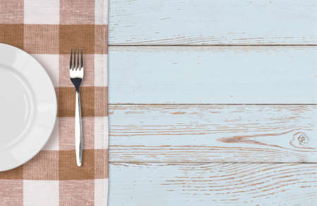 dinner plate and fork setting top viewの写真素材