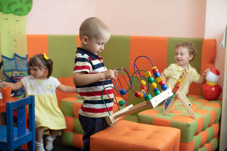 Group of children playing in kindergarten or daycare centreの写真素材