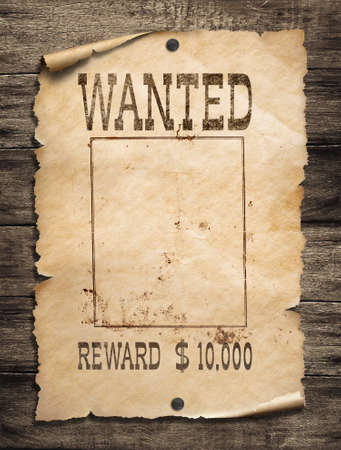 Wanted wild west poster on wood backgroundの写真素材