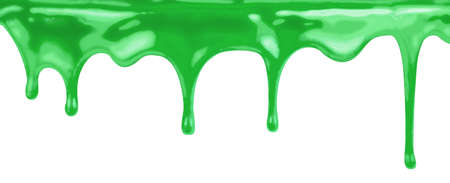 liquid green paint dripping on white backgroundの写真素材