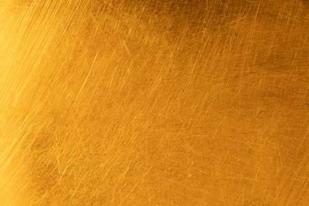 Real gold scratched metal texture backgroundの写真素材