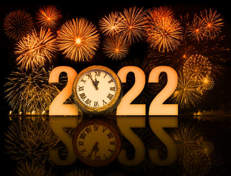 2022 new year fireworks with clockface 5 minutes before 12の写真素材