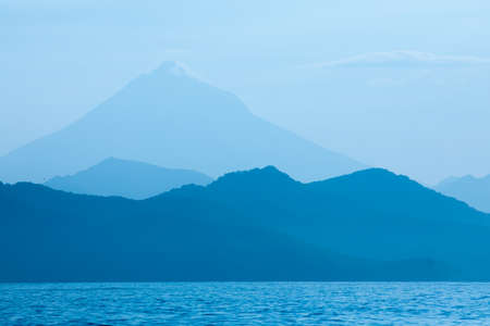Abstract blue mountains and sea natural backgroundの写真素材