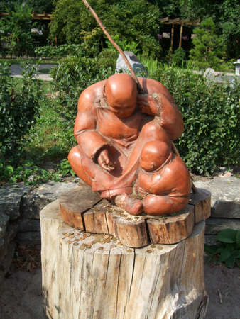 Sculpture from a tree in the Botanical garden of the cityの写真素材