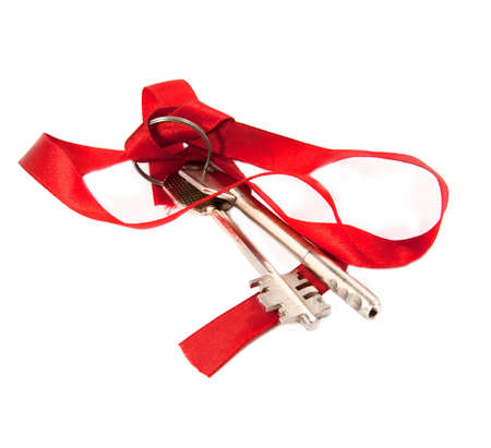 bunch of keys with red ribbon. Isolated keyの写真素材