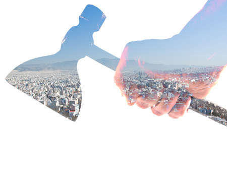 double exposure hand ax and urban landscape