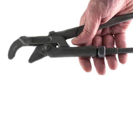 hand holding a wrench to repair water pipesの写真素材