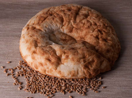 pita bread and wheat on a fabric backgroundの写真素材