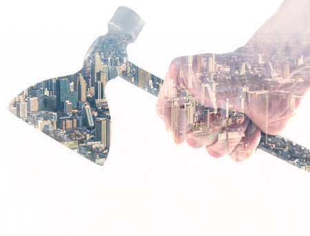 double exposure with a metal ax and cityscapeの写真素材