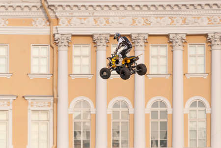 Sankt-Petersburg, Russia - Jule 04, 2015: the athlete performs a dangerous jump on a motorcycle, in St. Petersburg, Jule, 2015, Russiaのeditorial素材
