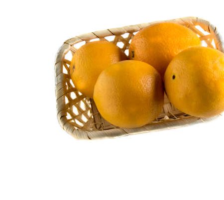 oranges in a basket isolated on white background
