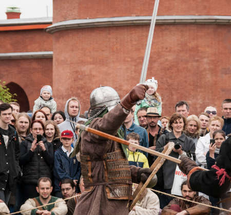 Saint Petersburg, Russia - may 28, 2016: Two Viking warriors fighting with swords. Historical reconstruction in St.-Petersburg, Russiaのeditorial素材