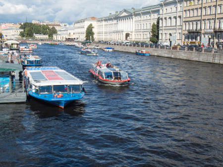 Saint Petersburg, Russia September 10, 2016: Excursion ships in the river of Fontanka. The view from Anichkov bridgein St. Petersburg, Russia.のeditorial素材