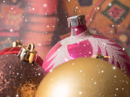 Colorful Christmas balls.the falling snowflakes. Christmas festive backgroundの写真素材
