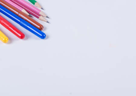 Markers and pencils on a white backgroundの写真素材