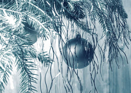 Festive Christmas background in retro style. Christmas ball on branchの写真素材