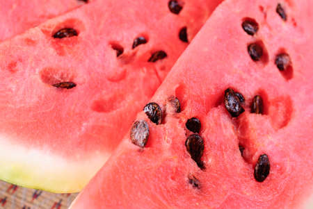Cut pieces of ripe watermelon on a plate close-up.の写真素材