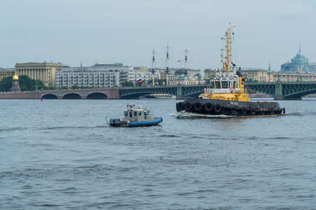 SAINT-PETERSBURG, RUSSIA - JULY 23, 2017: Tugboat on the Neva River. Rehearsal of the Naval Parade in St. Petersburgのeditorial素材