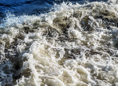 The resulting trace on the surface of water from a passing ship