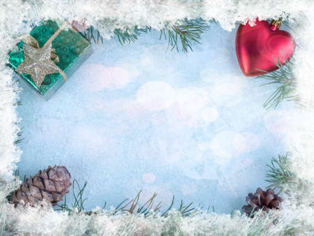 Background of fir branches and cones on a wooden backgroundの写真素材