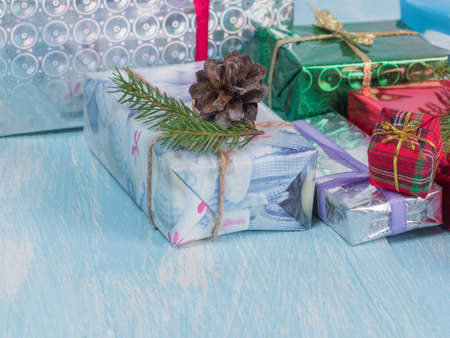 Gift boxes for the holiday with spruce branches.