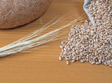 Bread, bag of wheat and ears. Baking background.