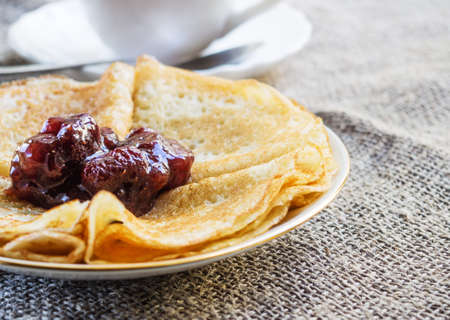 Delicious breakfast Strawberry jam on pancakes.の写真素材