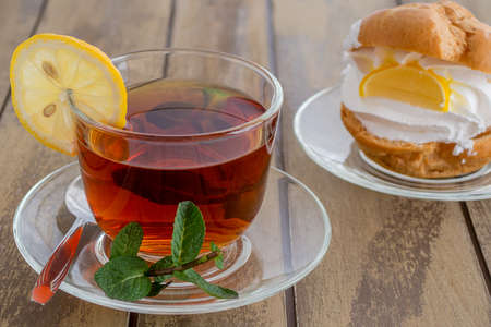 Tea with fresh leaves mint and lemon sliceの写真素材