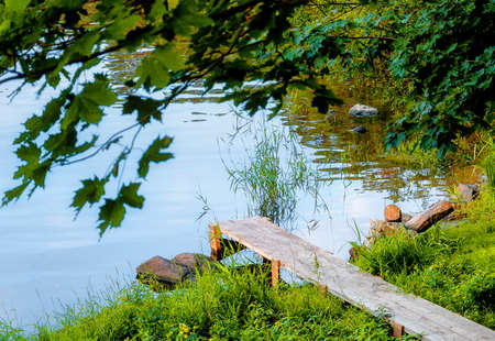 wooden pier from the planks near the riverの写真素材