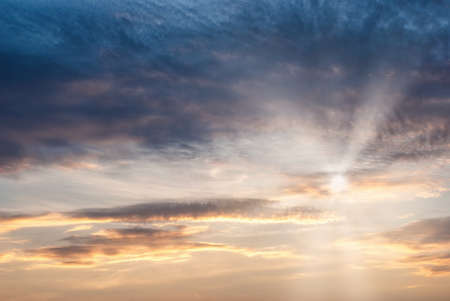 Sky with cirrus clouds, penetrating the rays of the sun through the cloudsの写真素材