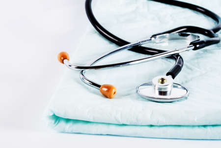 Stethoscope on doctor table in hospitalの写真素材