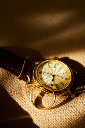 Gentleman's set. The morning of the groom. Wedding ring, watch, tie.の写真素材