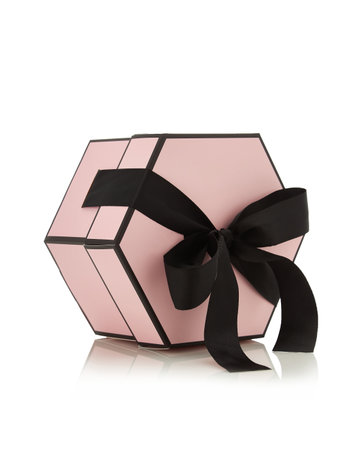 Pink pastel empty gift box with black ribbon isolated on white backgroundの写真素材