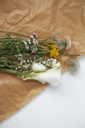 Bouquet daisies chamomile tulip feces flowers. Aesthetics minimal sunlight concept.の写真素材