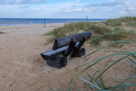 Wooden bench on the beach in North Sea, Germany. Europe.の写真素材
