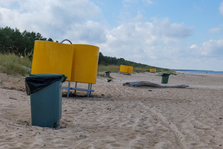 trash bin on the sand dunes of the baltic seaの写真素材