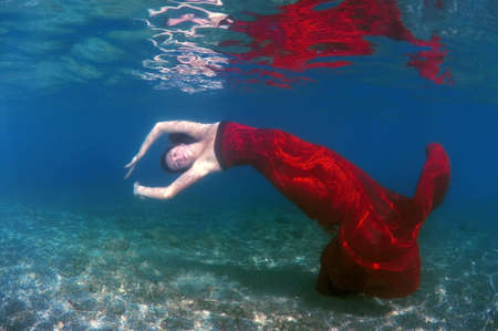 Woman with Underwater fashion in Aegean Sea, island Symi, Greeceの写真素材