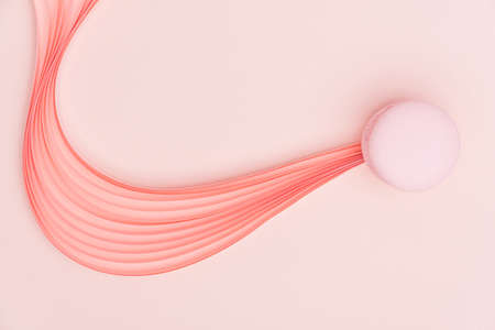 Pink Macaron and paper strips on a light backgroundの写真素材