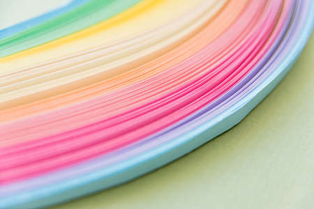 Paper strips in rainbow colors as a colorful backdropの写真素材