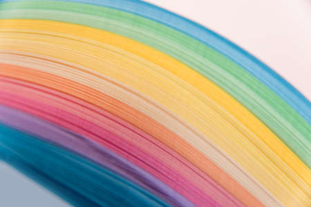Paper strips in rainbow colors as a colorful backdropの写真素材
