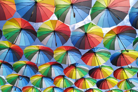Colorful umbrellas background. Lots of umbrellas coloring the sky in the city of Odessa, Ukraine. Street decorationの写真素材