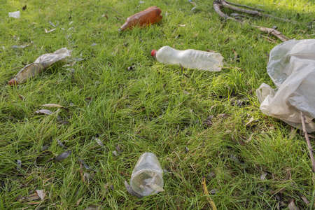 Plastic and other garbage thrown by tourists pollutes parks. Plastic garbage environmental pollution problem. Kartal Eco Park, Orlovka village, Reni raion, Odessa oblast, Ukraine, Eastern Europeの写真素材