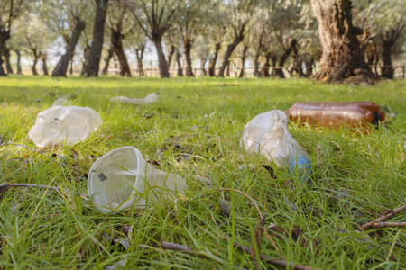 Plastic and other garbage thrown by tourists pollutes parks. Plastic garbage environmental pollution problem. Kartal Eco Park, Orlovka village, Reni raion, Odessa oblast, Ukraine, Eastern Europeの写真素材
