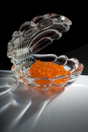 Red caviar in the glass shell