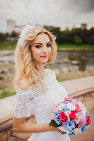Beautiful bride outdoors in a forest.の写真素材