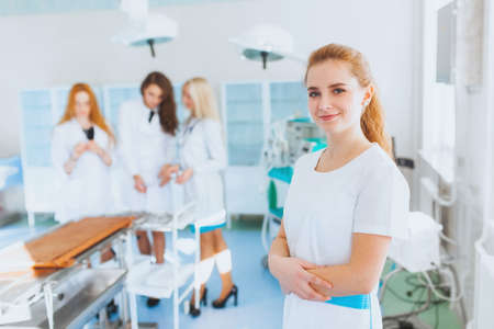 Medical student in surgery with a close-up smileの写真素材