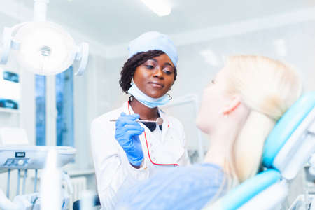 dentistry student standing in a dental treatment roomの写真素材