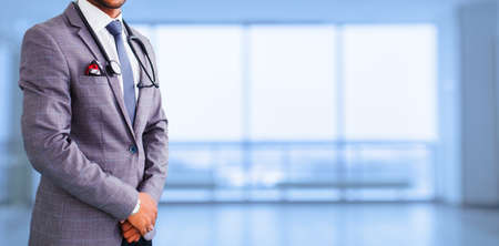 medical advertisement design. medicine, people and health care concept - close up of asian male doctor with stethoscope over blue background. promotional bannerの写真素材